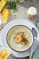 Puree soup mushrooms with croutons in a bowl on a light slate background. The concept of healthy eating. Diet menu. Copy space.
