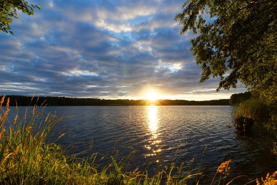 Fototapeta View on a lake during sunrise