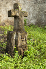 Grave Marker / A wooden grave marker with carved cross and the word love.