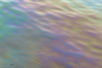 Oil stains on the water surface abstract texture and background