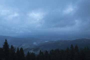 view of low mountains on a cloudy day