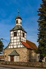 Fototapeta na wymiar Westturm der historischen Dorfkirche Blankenfelde