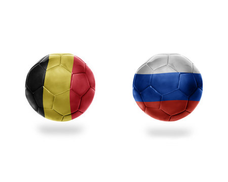 football balls with national flags of belgium and russia.