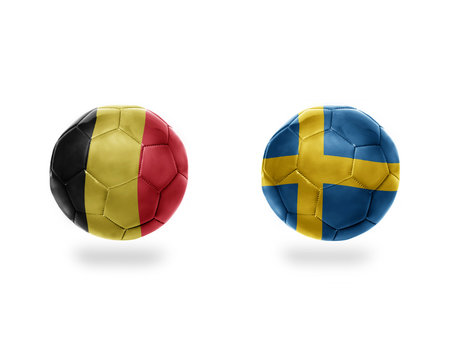 football balls with national flags of belgium and sweden.