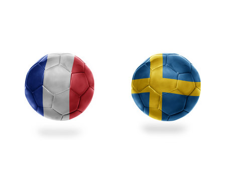 football balls with national flags of france and sweden.