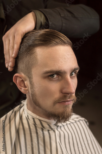 Man Having A Shave And Haircut At The Barber Shop