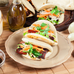 Gua bao, steamed buns with pork belly and vegetable