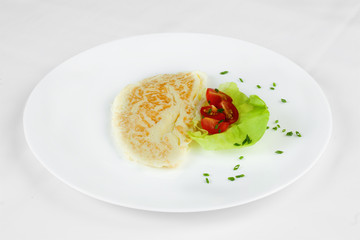 Delicious omelet with tomatoes, lettuce and greens.