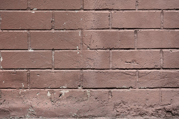 Red smooth brick wall background, terracotta color, close-up.