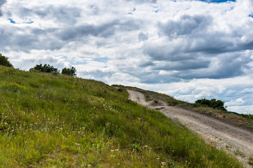 Fototapeta na wymiar Idyllic rural landscape - path in the high hills
