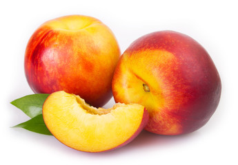 Fototapeta na wymiar Fresh peaches on white background