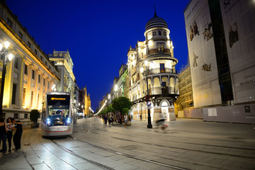 Fototapeta na wymiar Seville, Spain - June 21, 2018: Tram on the Avenida de la Constitución in Seville.