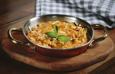 Traditional turkish food menemen made by eggs and tomatoes.
