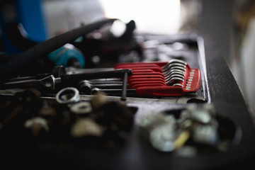 Close up shot of different tools in car repair shop or garage
