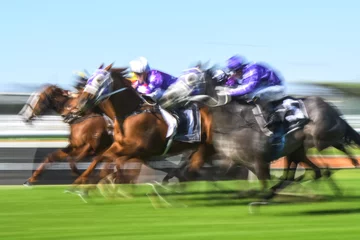 Wandaufkleber Motion blurred horse racing group image © PicMedia