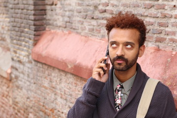 Funny man rolling his eyes during call