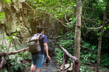 Naklejka na ściany i meble Asian traveler or backpacker in National park, Nature travel concept