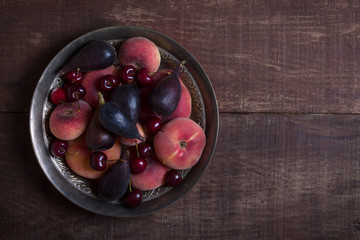 Fruits on the dark wooden table. Top view