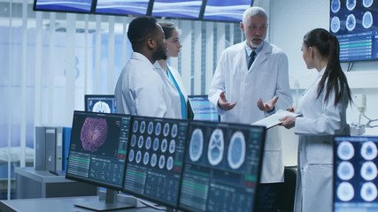 Meeting of the Team of Medical Scientists in the Brain Research Laboratory. Neurologists / Neuroscientists Having Heated Discussion Surrounded by Monitors Showing CT, MRI Scans.
