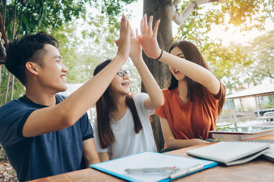 Student University Success High-five Project Concept, Students Asian Working Complete And Finish Job Happy Feeling With Friends Smiling At Campus High School College