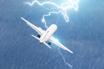 Naklejka na ściany i meble Lightning strike on an airplane electric discharge during a thunderstorm on takeoff at the airport.