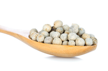 Pepper seed in wood spoon  on white background