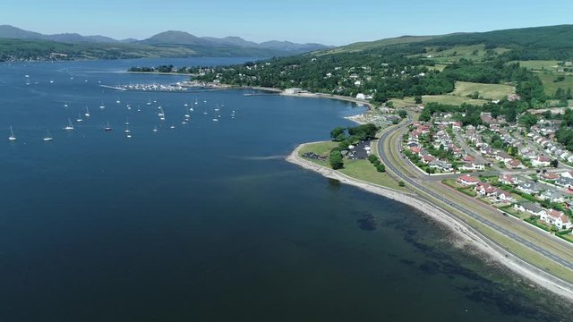 4K aerial footage over the river Clyde towards Helensburgh Sailing Club, and Rhu Marina.