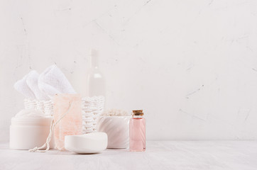 Fototapeta na wymiar Luxury organic body and skin care spa cosmetics collection, pink oil and natural bath accessories on white wood background.
