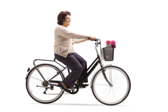 Mature Woman Riding A Bicycle