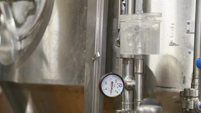 Beer production in the factory. Brewhouse. Beer is cooled in tanks.