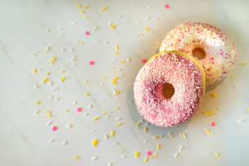 Donuts with Frosting and Sprinkles