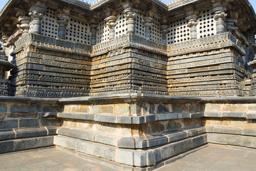 View of stellate form of shrine outer wall at the Hoysaleshwara Temple, Halebid, Karnataka. View from North East. - obrazy, fototapety, plakaty