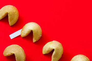 Fortune cookies pattern on red background. Copyspace