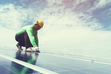 engineer team working on replacement solar panel in solar power plant;engineer and electrician team...