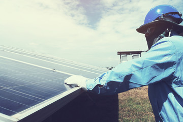 engineer team working on replacement solar panel in solar power plant;engineer and electrician team...