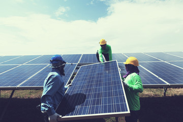 engineer team working on replacement solar panel in solar power plant;engineer and electrician team...