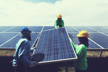 engineer team working on replacement solar panel in solar power plant;engineer and electrician team...
