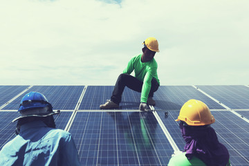 engineer team working on replacement solar panel in solar power plant;engineer and electrician team...