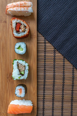 fresh sushi roll selection on bamboo