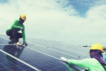 engineer team working on replacement solar panel in solar power plant;engineer and electrician team...