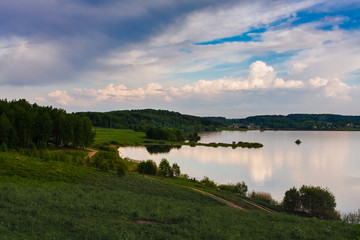 Country landscape with lake and blue sky