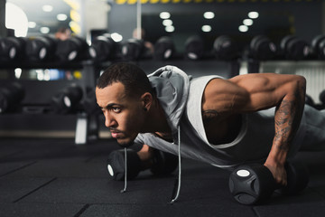 Young man fitness workout, push ups or plank