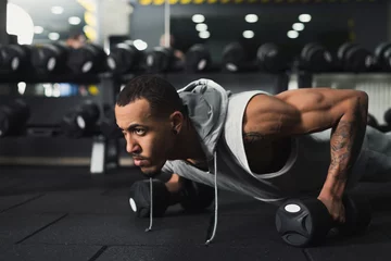 Poster Young man fitness workout, push ups or plank © Prostock-studio