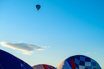 Bright blue hot air balloon against blue clear sky © smspsy