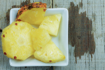 Pineapple pieces on dish.