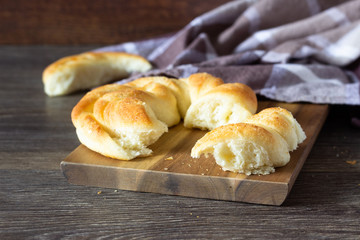 Tasty bun on wooden background. Bread roll bun. 