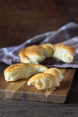 Tasty bun on wooden background. Bread roll bun. 