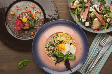 Restaurant dinner with salad and fried eggs