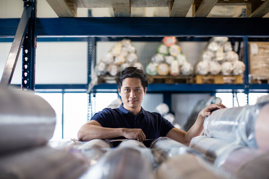 Portrait of male employee in distribution warehouse