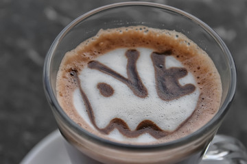 Cup of coffee with the inscription love